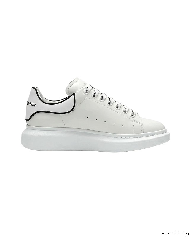 The minimalist style of McQueen white sneakers.